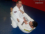 Armbar to Reverse Roll Guard Sweep