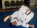 Armbar to Reverse Roll Guard Sweep 9