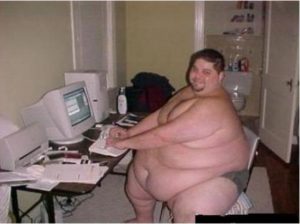 Fat guy in underwear by computer