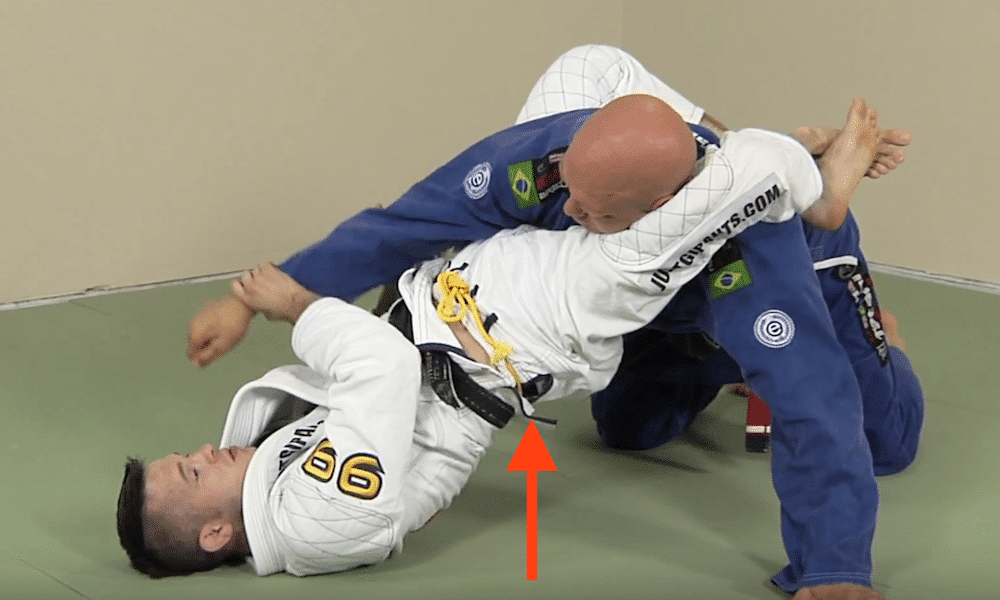 half guard triangle choke - lifting hips up to move arm across