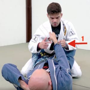 Cross Lapel Grip Break Step 1: Secure the Gi Material at the Wrist