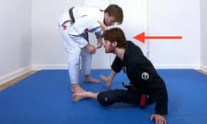 Collar Drag 3, Plant your hand and bring your upper body forward to initiate