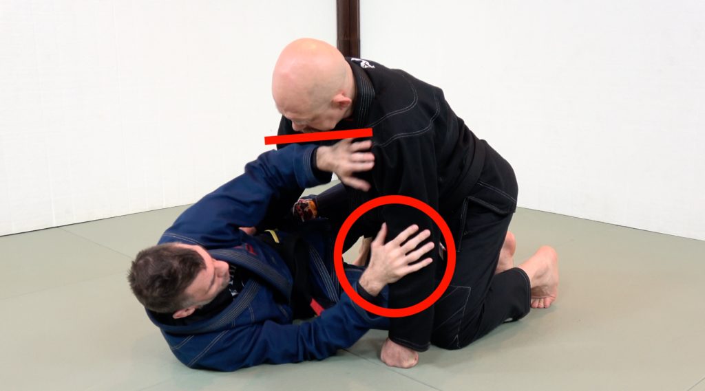 Framing with hand and forearms in the half guard