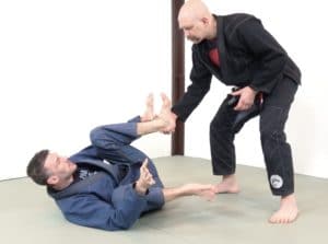 Recumbent guard vs a standing opponent in the engagement phase - opponent wins grips 1