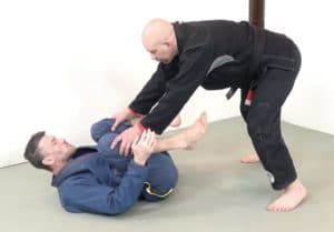 Recumbent guard vs a standing opponent in the engagement phase - opponent wins grips 2