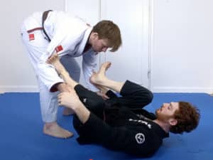 Push down and back with your foot to reset the guard