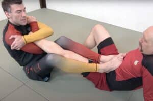 Aoki Lock with Both Feet on Belly