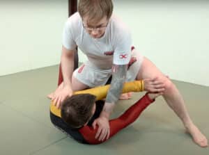Kneemount escape 2 - Frame against his top knee with the wu tang hand position