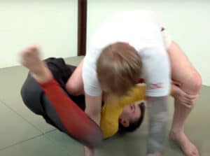 Kneemount escape 3 - Keep his weight off of you and spin your head between his legs