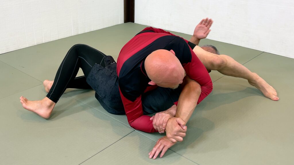 You can finish the Kimura armlock traditionally (i.e. by stepping over his head with your left leg)...